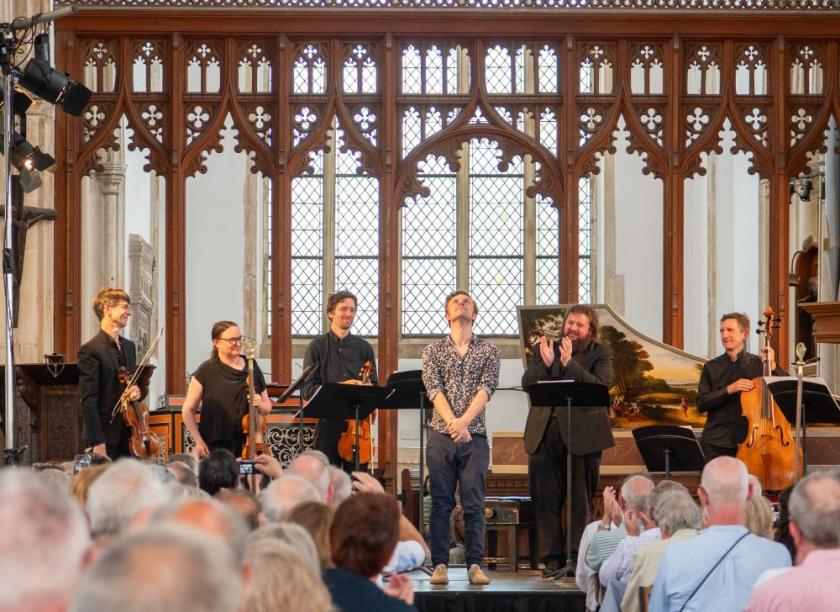 Tom Coult receives a big ovation for the world premiere of 'Black Shuck Lament', given by Allan Clayton and members of the Dunedin Consort in Blythburgh Church