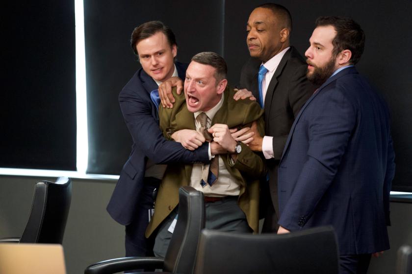 Out of order: Craig Waterman (Tim Robinson) restrained by his work colleagues