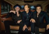 High rollers: Mick, Keith and Ronnie cab it up on the way to the Hackney Empire, London, 6 September