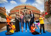Flanked by young musicians, four of this year's Proms performers not featured below: Evelyn Glennie, Danielle de Niese, Katie Derham and Nicholas Collon