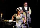 Tosca (Amanda Echalaz) faces off against Scarpia (Roberto Frontali)