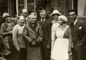Nielsen sporting his 60th birthday dressing gown, surrounded by family and maid, in 1925