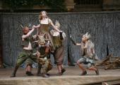 Michelle Terry as Titania with some of her fairies, wild creatures of the earth and woods