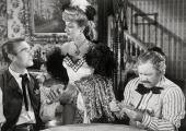 Hearts are trumps: Randolph Scott, Ann Dvorak, and Edgar Buchanan in 'Abilene Town.'