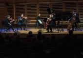 The principal strings of Aurora Orchestra with pianist Steven Osborne at Kings Place