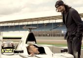 Wheels up: Jenson Button gets some tips from Keanu Reeves