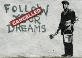 Banksy's 'Follow Your Dreams Cancelled' on a wall in Boston's Chinatown, 2010