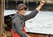 Emilia Jones as Ruby, working on the family boat before school begins.