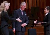 Donatella Flick and the then Prince Charles present the 2014 award to Elim Chan