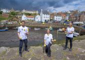 Three of the Gandini Juggling group at Crail Harbour