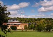 Glyndebourne with the wind turbine on the hill above