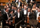 All grown up: Gustavo Dudamel and his Venezuelan players at the end of last night's concert