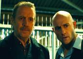 Rhys Ifans as Gubby, with Mark Strong as Daniel Milton
