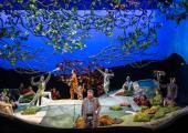 Inspirational magic:  James Rutherford as Forester with the cast of The Cunning Little Vixen