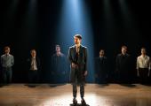 Kyle Soller with the company of The Inheritance at the Young Vic
