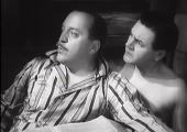 Charters (Radford) and Caldicott (Wayne) find themselves in a compromising position