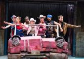 The cast performs a musical number in a replica of Marge Simpson's car