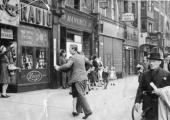 Dancing outside the Levy’s shop on Whitechapel High Street, 1940s