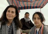 Looking upstream: Sara (Darina Al Joundi) and Reema (Zainab Joda) with Ali Kareem as a Tigris boatman
