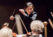 Elim Chan conducting the Royal Scottish National Orchestra
