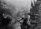 Staged: Soviet soldiers raising the red flag over the Reichstag, May 1945, by Yevgeny Khaldei