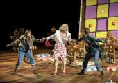 Not-so-sweet 'Rosina Lickspittle' (Alasdair Elliott) entraps Gretel (Susanna Hurrell) and Hansel (Rachel Kelly)