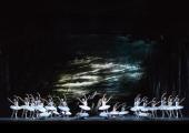 A dark and stormy night: John Macfarlane's lakeside is a spooky setting for swans in the Royal Ballet's new 'Swan Lake'
