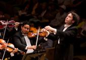 Dudamel and members of the Simón Bolívar Symphony Orchestra