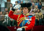 Her Maj (Olivia Colman) takes the salute