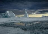 Peering into an ominous future: clouds besiege an ice needle in Northern Greeland