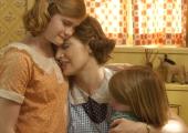 Kate Winslet as Mildred Pierce with daughters Veda (Morgan Turner, left) and Ray (Quinn McColgan)
