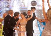 Dancing queen: Kara Tointon and partner Artem Chigvintsev lift the 2010 'Strictly' trophy