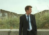 Man on (metaphorical) wire: MI5 officer Clive Owen keeps tabs on the Troubles