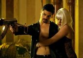 Or are you just pleased to see me? Dominic Cooper and Ludivine Sagnier as Uday Hussein and his squeeze