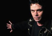 Rich Hall on tour: Swigging his beer bottle, he comes across as grumpy with twinkles