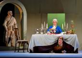 The statue of the Commendatore (David Fraser) comes to dinner with Don Giovanni (Marcus Swietlicki) as Pasquariello (Daniel Barrett) cowers