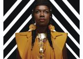 Eno Taylor, frontwoman of Ibibio Sound Machine, owning the cover