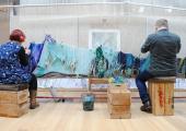 Weavers at work: a team of five spent two and half years making Chris Ofili's tapestry 'The Caged Bird's Song'