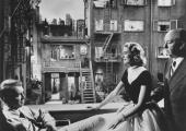 James Stewart, Grace Kelly and Alfred Hitchcock on the set of Rear Window