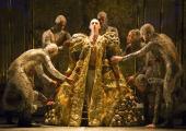 Akhnaten (Anthony Roth Costanzo) puts on his robes of state, aided by the Gandini Jugglers