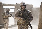 Masked man: Pilou Asbaek reconnoitres hazardous Afghan locations