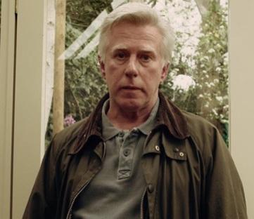 Phil Davis, wearied, as David de Gale