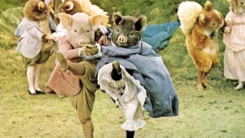 Pigling Bland (Alexander Grant) and his Berkshire sweetheart (Brenda Last) join in the animal tarantella