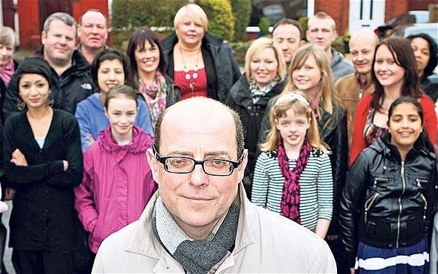 Presenter Nick Robinson with residents of 'The Street That Cut Everything'