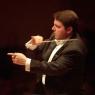 Conductor Andrew Litton: bouncing around like a rubber ball, busily keeping track
