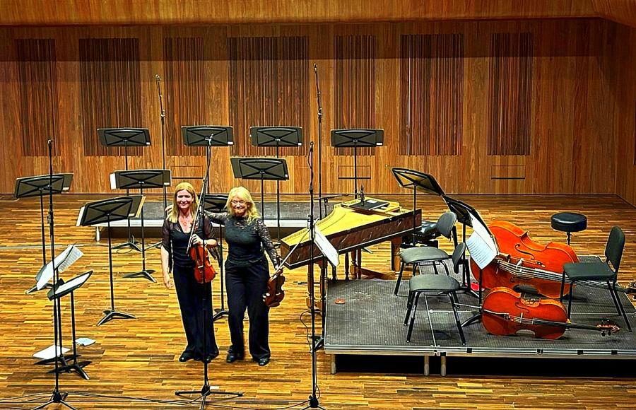 Last two players standing take a bow after the end of Haydn's 'Farewell' Symphony