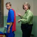 Chris Lilley as Gran with one of her juvenile charges in superhero pyjamas