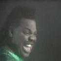 A still from the 'Love Can't Turn Around' video
