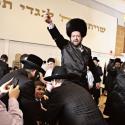 Avi Bresler held aloft at his son's wedding