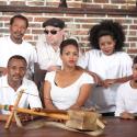 The core members of Dub Colossus pose with a messenqo (a one-string fiddle) 
